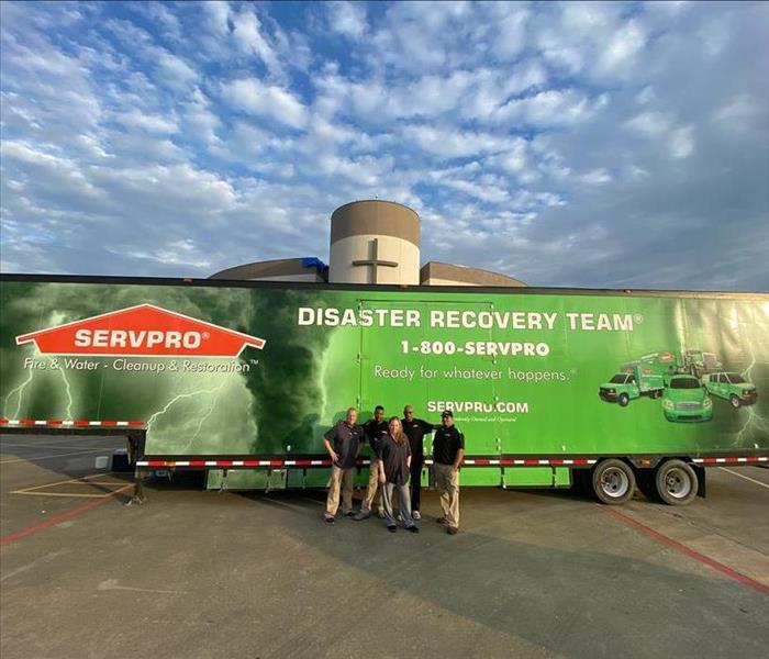 SERVPRO Employees standing in front of a truck